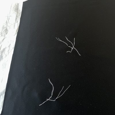 Thread-marking the placement of the welt pockets. 
